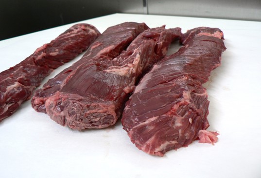 slabs of meat on a table
